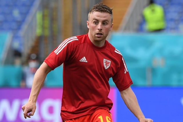 Joe Morrell warms up for Wales. Picture: Alberto Lingria - Pool/Getty Images