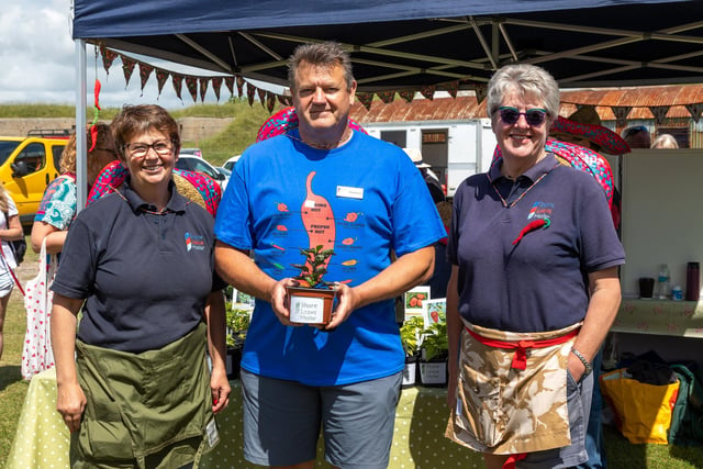Members of the Gosport based Shore Leave Haslar with their home-grown chilli plants. Pictured: Nicola Canning, Andy Day (volunteer, ex RN) and Chris Robson (Project Lead, ex RN). Picture: Mike Cooter (210522)