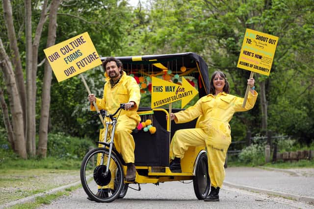 Lorna Rees and Adam Coshan, both of Gobbledegook Theatre Company, are delivering their Signs of Solidarity in their pedicab to local people who have made a difference to the community during the pandemic. Picture: Chris Moorhouse (jpns 140521-02)