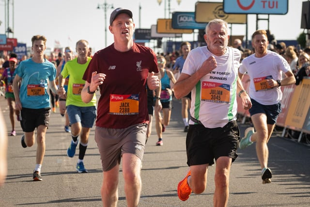 Pictured is: Runners cross the line to finish
Picture: Keith Woodland (151021-688)