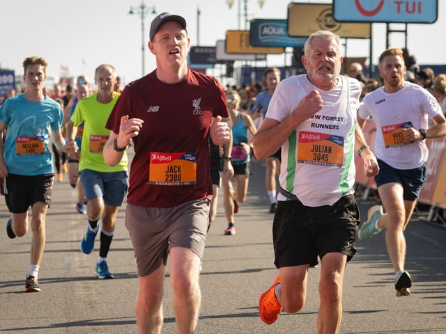 Pictured is: Runners cross the line to finish
Picture: Keith Woodland (151021-688)