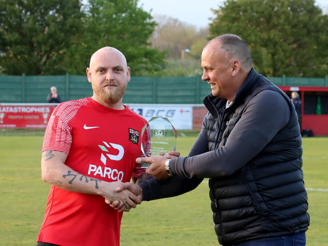 Former Reds boss Pete Stiles, right, presents Ash Tattersall with a special trophy after he recently set a new club record of 429 outfield appearances. Picture by Ken Walker