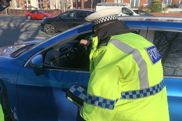 Police on a mobile phone operation in Fareham on March 16 2020. Several drivers were handed fixed penalty notices of £200 with six points on their licences. Picture: Ben Fishwick