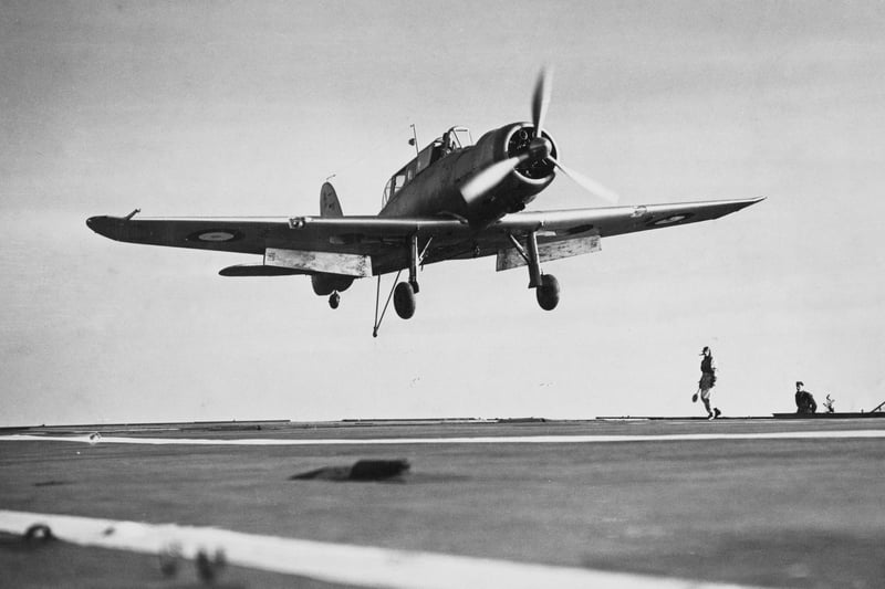 A Royal Navy Fleet Air Arm Blackburn B24 Skua MkII carrier-based low-wing, two-seater, single-radial engine dive bomber/fighter aircraft of No.803 Naval Air Squadron comes into land on the flight deck of the aircraft carrier HMS Ark Royal on 16th November 1939. (Photo by Fox Photos/Hulton Archive/Getty Images).