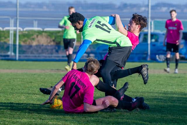 Action from the first grassroots game in Portsmouth after lockdown restrictions were eased - AFC Trades (pink) v Fratton Trades  at the Langstone Harbour ground on Eastern Road. Picture: Habibur Rahman