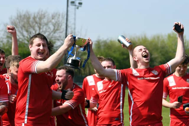AFC Stubbington lift the Len Day Cup.
Picture: Neil Marshall