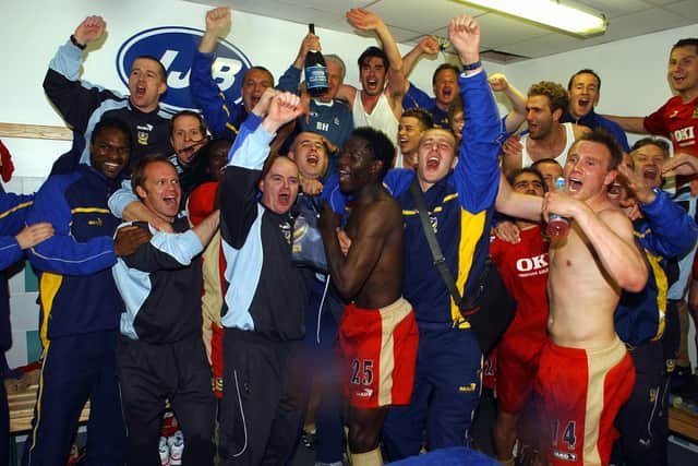 Pompey celebrate in the Wigan dressing room after staying up in April 2006. Brian Priske is pictured far right at the back. Picture: Steve Reid