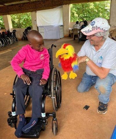 Neil Salter (otherwise known as Grandad) entertaining with Henry the Macaw!
