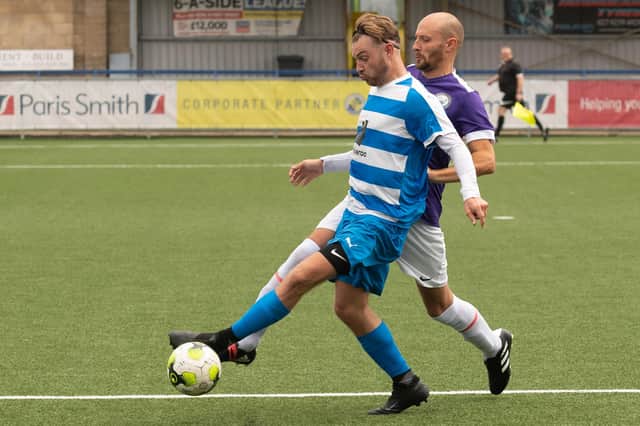 Brad Hartill (blue/white) was on target for AC Copnor in their Portsmouth Sunday League Challenge Cup draw with Wicor Mill. Copnor progressed 5-4 on spot-kicks. Picture: Keith Woodland