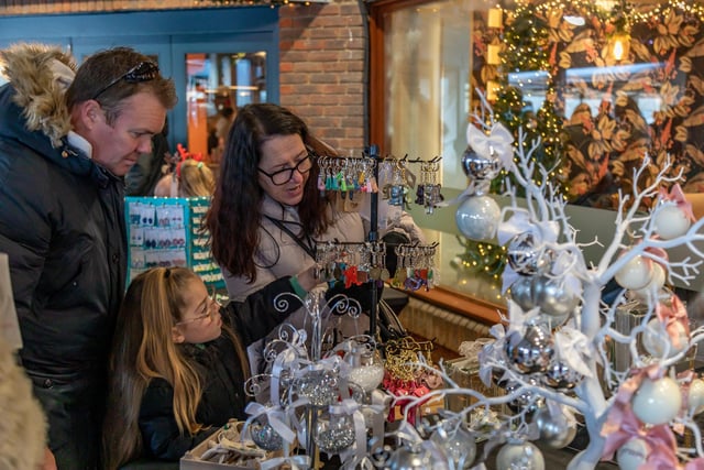 Shoppers at the Festival of Christmas in Port Solent. Picture: Mike Cooter (091223)
