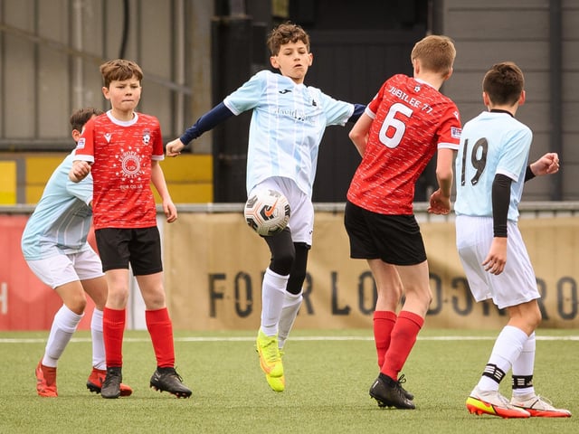 Action from the Portsmouth Youth League Geldard Invitation Cup final between Jubilee 77 U13s and Castle United U13s (light blue and white kit). Picture: Keith Woodland (190321-664)