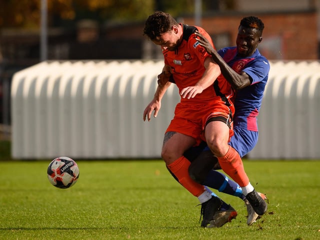 Portchester's Charlie Williamson and USP striker Lamin Jatta. Picture: Keith Woodland