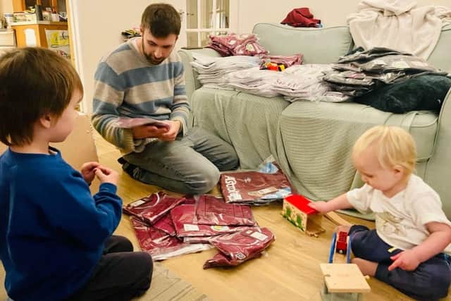 Paul Watson organising shirts donated as part of the Kitmas campaign