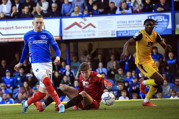 Ronan Curtis scores Pompey's winner against Lincoln after Imps keeper Jordan Wright's failure to hold on to Sean Raggett's effort from the edge of the box    Picture: Barry Zee