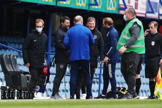 Danny Cowley, Paul Cook and former first-team coach Joe Gallen speak after Pompey's 2-1 victory over Ipswich in March. Picture: Joe Pepler