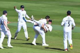 Brad Wheal celebrates with Nick Gubbins after taking the wicket of Chemar Holder as Hampshire defeat Warwickshire by 60 runs at Edgbaston. Photo by Tony Marshall/Getty Images.