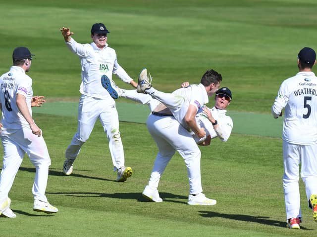 Brad Wheal celebrates with Nick Gubbins after taking the wicket of Chemar Holder as Hampshire defeat Warwickshire by 60 runs at Edgbaston. Photo by Tony Marshall/Getty Images.
