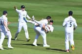 Brad Wheal celebrates with Nick Gubbins after taking the wicket of Chemar Holder as Hampshire defeat Warwickshire by 60 runs at Edgbaston. Photo by Tony Marshall/Getty Images.