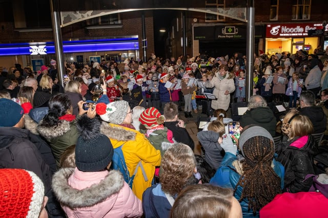 Large crowds gathered to see the school children sing Christmas carols.  Photos by Alex Shute