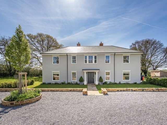This home is set in 1.5 acres and it has four bedrooms, four bathrooms and three reception rooms.