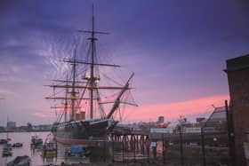 Divers are analysing the hull of  HMS Warrior using ultra sonic scanners.