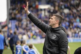 Pompey head coach John Mousinho waves to his family ahead of the Blues' 2-2 draw with Wycombe at Fratton Park