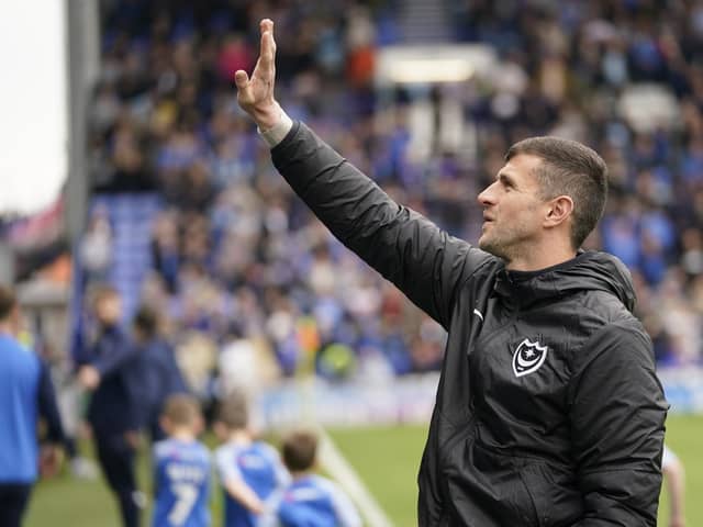 Pompey head coach John Mousinho waves to his family ahead of the Blues' 2-2 draw with Wycombe at Fratton Park