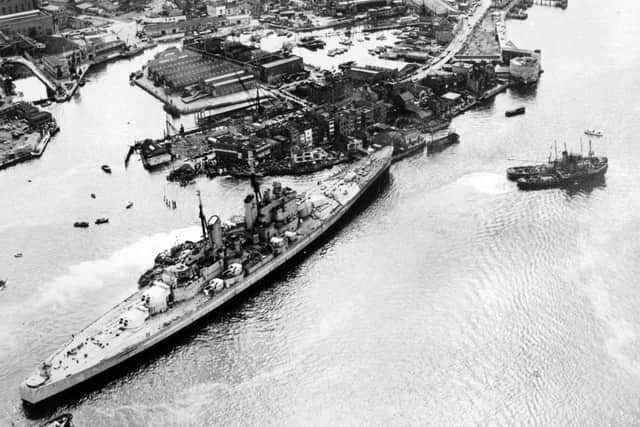 HMS Vanguard runs aground in Portsmouth Harbour after breaking loose but narrowly avoids the Still & West pub,  August 4, 1960. The News PP5335