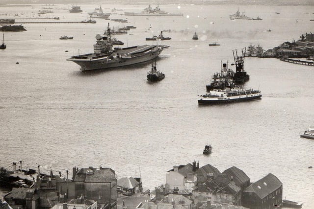 HMS Victorious leaving Portsmouth Harbour  in 1958. Above her is the battleship HMS Vanguard. Picture: Robin Kay collection