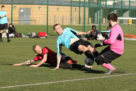 Burrfields striker Jack Palmer challenges the Horndean keeper. Picture by Kevin Shipp