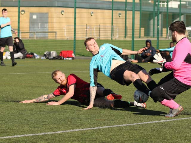 Burrfields striker Jack Palmer challenges the Horndean keeper. Picture by Kevin Shipp