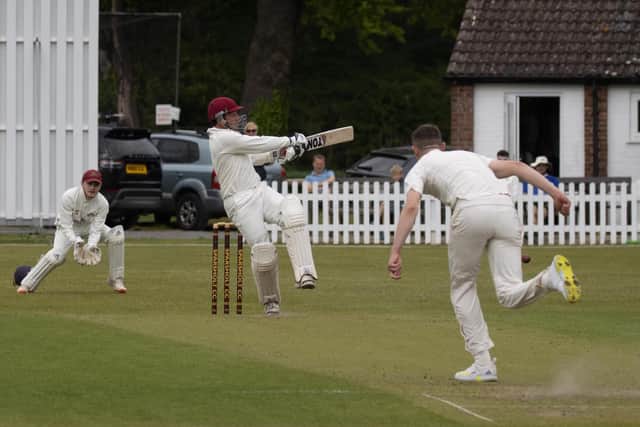 Richard Warner hits a boundary on his way to 84 against Sparsholt. Picture by Bob Selley.