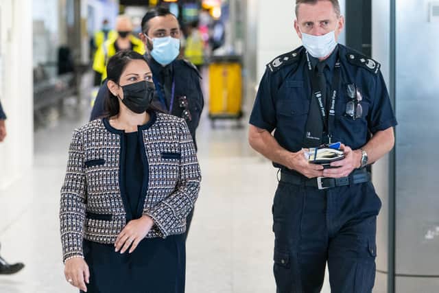 Home secretary Priti Patel with Regional Director of Border Force Tim Kingsbury at Heathrow Airport, London, where refugees from Afghanistan are arriving on evacuation flights.