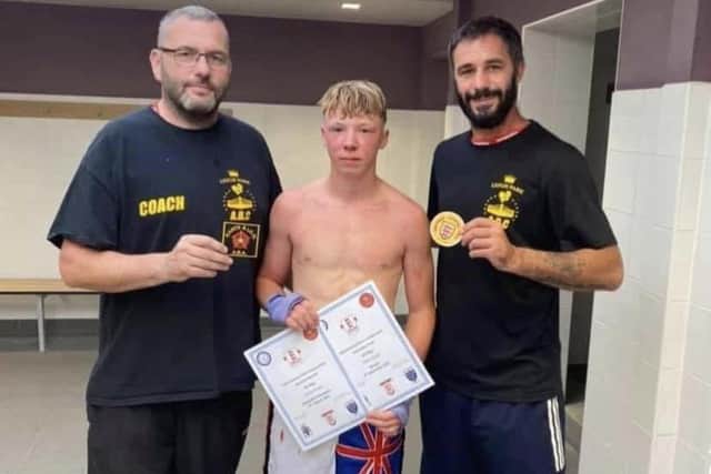 John-Henry Keet, centre, with coach Rob Ford, right, and Leigh Park Amateur Boxing Club head coach Billy Bessey