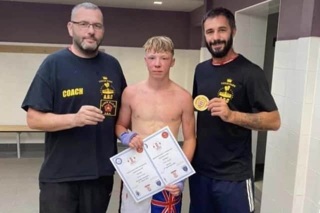 John-Henry Keet, centre, with coach Rob Ford, right, and Leigh Park Amateur Boxing Club head coach Billy Bessey
