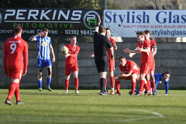 Horndean protest after an early first-half penalty is awarded against them Picture: Neil Marshall