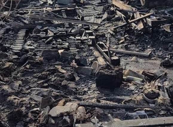 Damage caused to the log cabin.