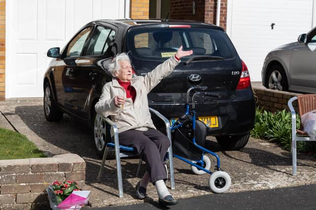 Jean Morley has 'Happy Birthday' sung to her by neighbours on her 96th birthday Picture: Mike Cooter