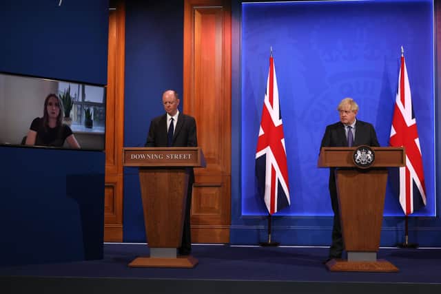 LONDON, ENGLAND - JUNE 14: Britain's Prime Minister Boris Johnson and Chris Whitty, Chief Medical Officer for England & Chief Medical Adviser to the UK during a Covid-19 pandemic virtual press conference inside the Downing Street Briefing Room on June 14, 2021 in London, England. The Prime Minister confirms a four-week delay to the lifting of all restrictions in England beyond 21 June. (Photo by WPA Pool/Getty Images)