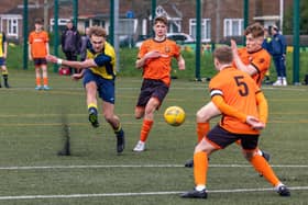 Action from the 2-2 draw between the under-18s of Moneyfields (blue/yellow kit) and AFC Portchester (orange/black kit). Picture: Mike Cooter