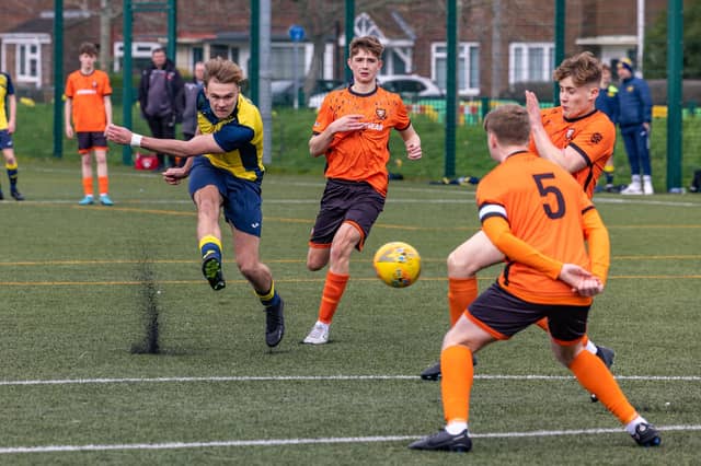 Action from the 2-2 draw between the under-18s of Moneyfields (blue/yellow kit) and AFC Portchester (orange/black kit). Picture: Mike Cooter
