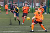 Action from the 2-2 draw between the under-18s of Moneyfields (blue/yellow kit) and AFC Portchester (orange/black kit). Picture: Mike Cooter