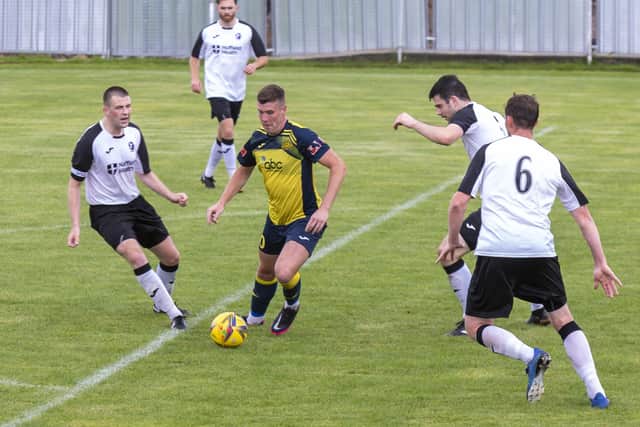 Fred Penfold (yellow) scored twice for Southsea United. Picture: Mike Cooter