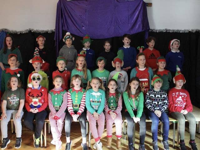 Year 5 pupils dressed in their elf outfits.