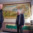 Owners of the pub, Mick Forfar and Steve Kingsley in front of a historic tile artwork uncovered during the venue's refurbishment. Picture: Habibur Rahman