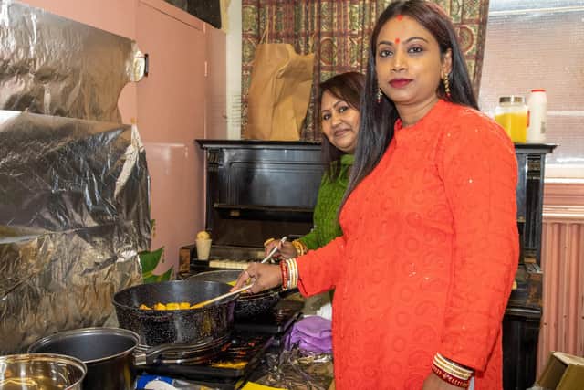 Cooking food to serve at the festivities. Photo by Alex Shute