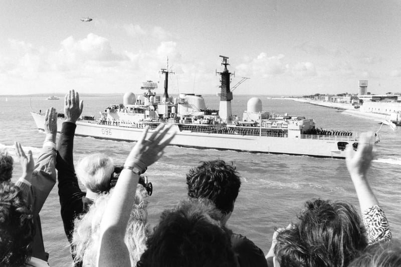 People give a wave to the returning sailors aboard HMS Gloucester in August 1990. The News PP4764