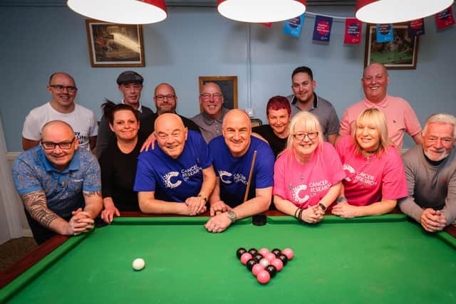 Cosham resident Andy Jacques during his 24 hour pool marathon at Portsmouth Conservative Club in aid of Cancer Research UK. Andy pictured with his fellow fundraisers and pool opponents. Picture: Paul Collins