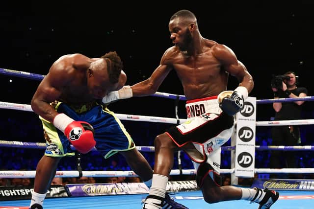 Chris Kongo, right, lands a shot on Serge Ambomo. Picture: Dan Mullan/Getty Images