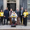 Football pundit Chris Kamara MBE (2nd left) handing in a petition, from the end-of-life charity Marie Curie, to Downing Street calling for improved financial support for people with a terminal illness, alongside terminally ill campaigners Tammy Prescott and Cheryl Whittaker, and their husbands Lintyn and Mark. Picture date: Thursday February 23, 2023. PA Photo. Photo credit should read: Jeff Moore/PA Wire